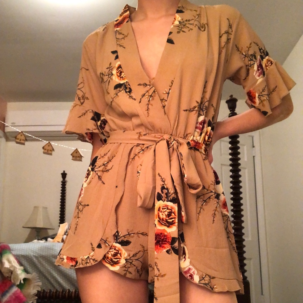 Ruffled romper with sash